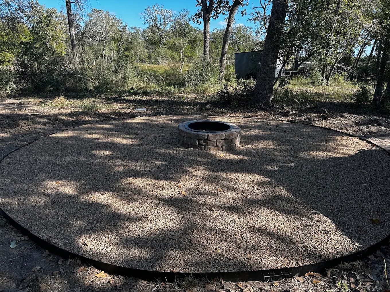 Custom fire pit with gravel pad installation