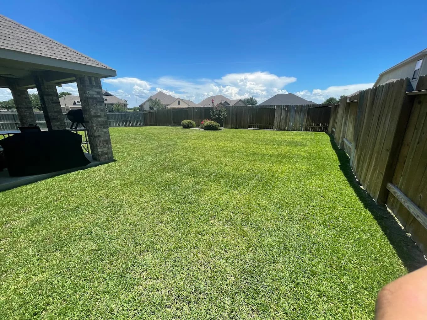 Large backyard lawn with gazebo in College Station