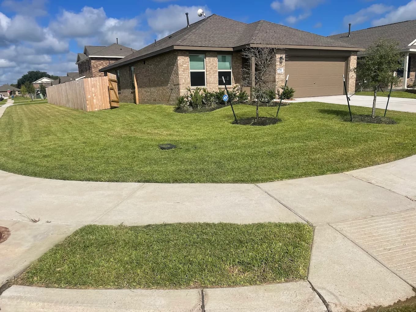 Fresh cut front lawn with clean stripes in Navasota TX